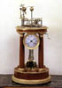 A fine Empire gilt bronze mounted amboyna orrery clock made by Raingo Freres and LeRoy & Fils, Paris